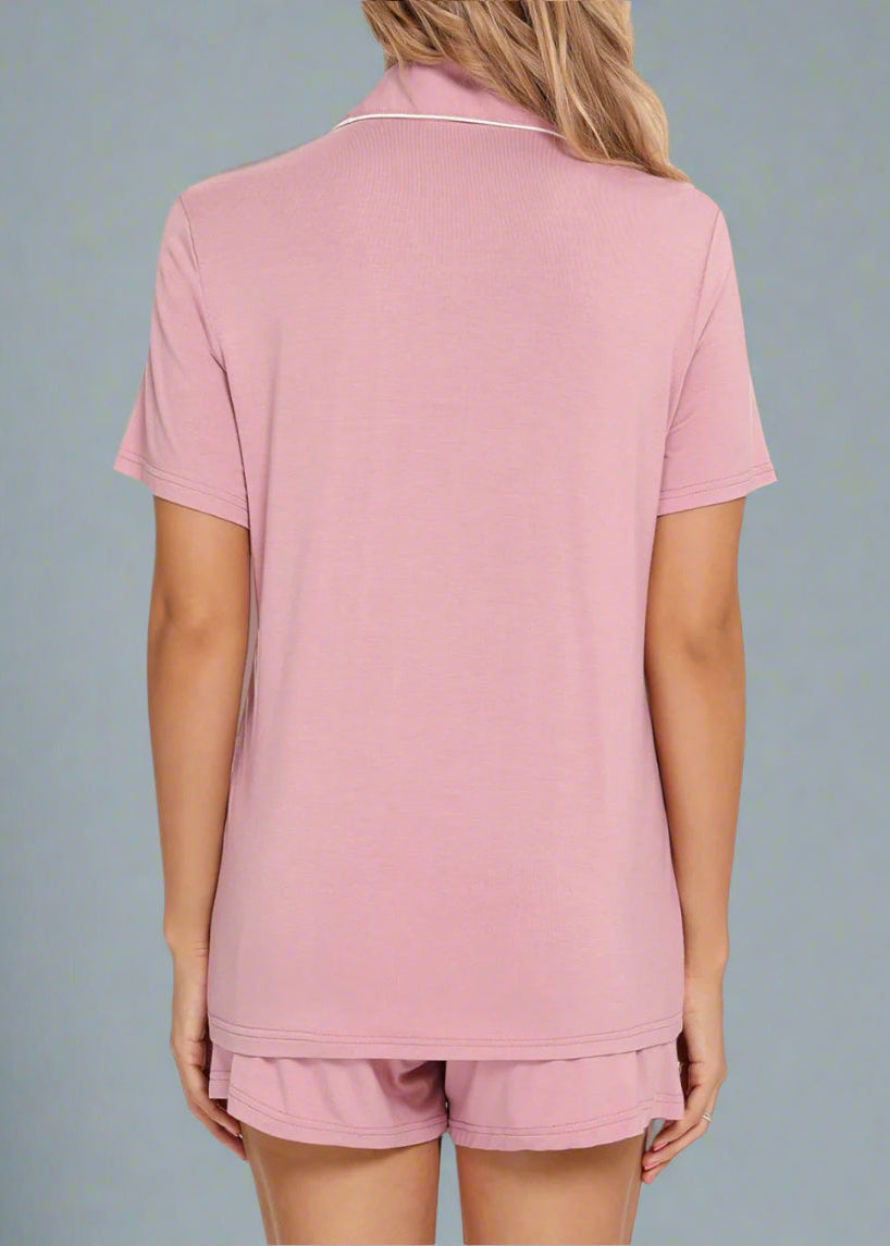 Back view of dusty pink short pyjama set, showing relaxed fit and piping detail.
