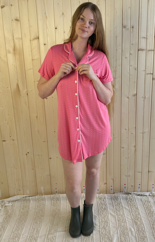 Side view of coral pink short sleeve nightie in bamboo fabric, breathable and lightweight, model smiling