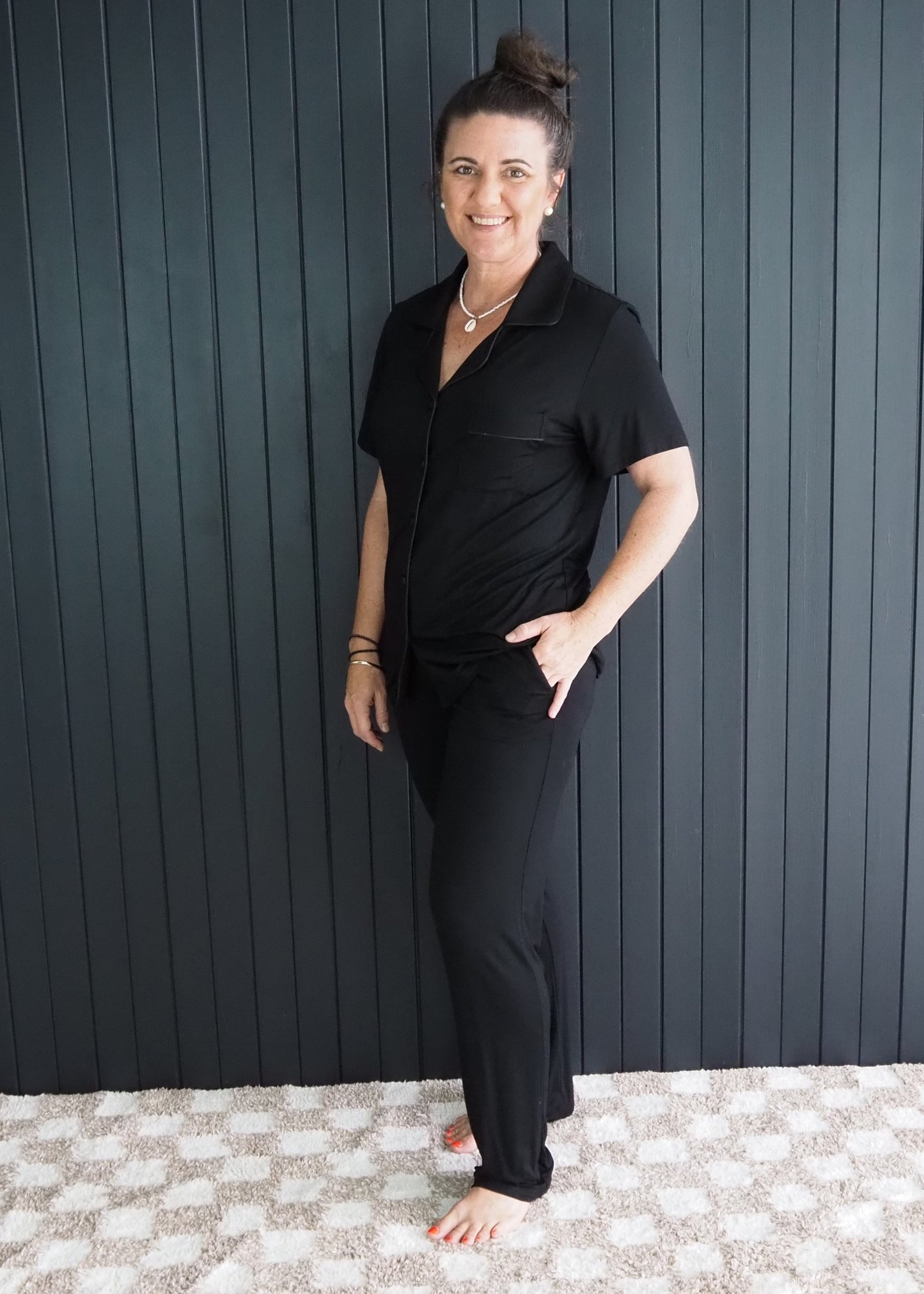 Women’s black bamboo sleepwear set with short sleeves and full-length pants