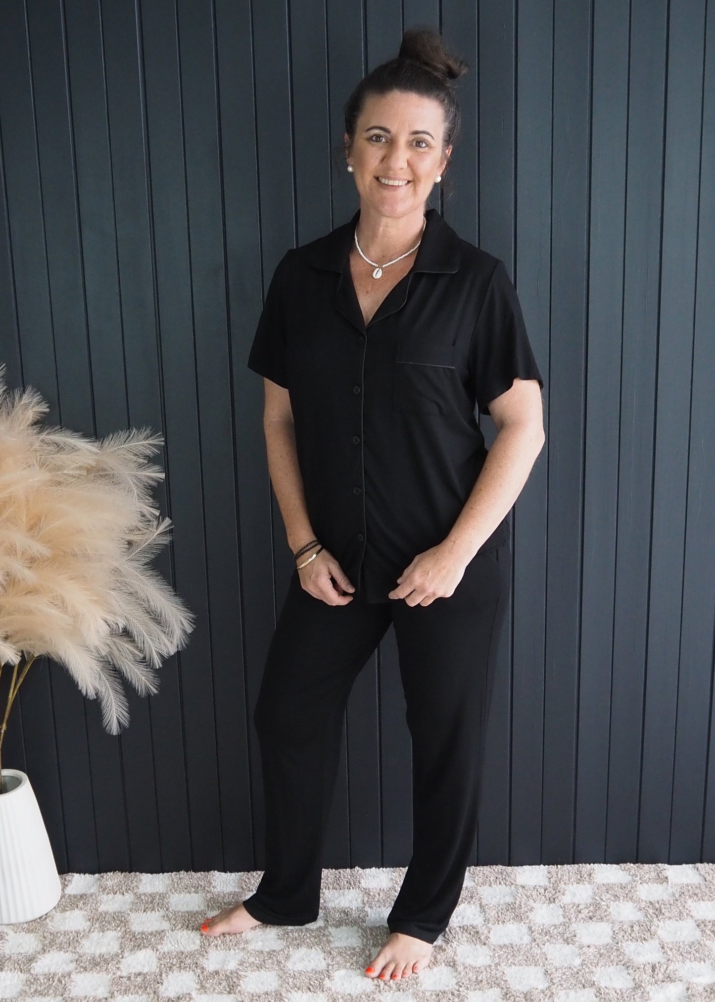 Women’s black bamboo sleepwear set with short sleeves and full-length pants