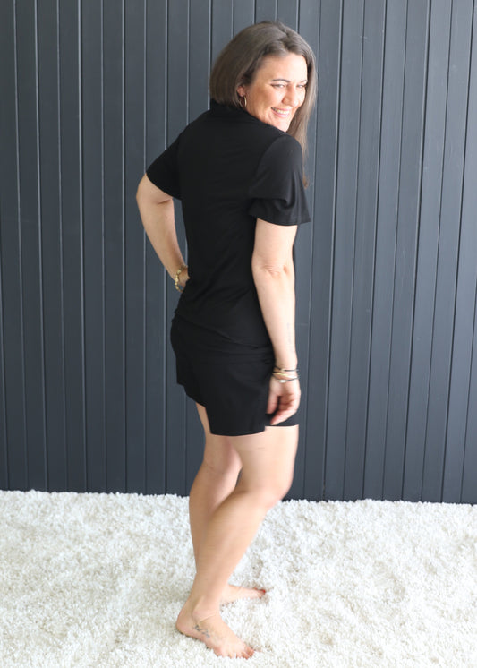 Lifestyle shot – woman lounging in black bamboo PJ short set