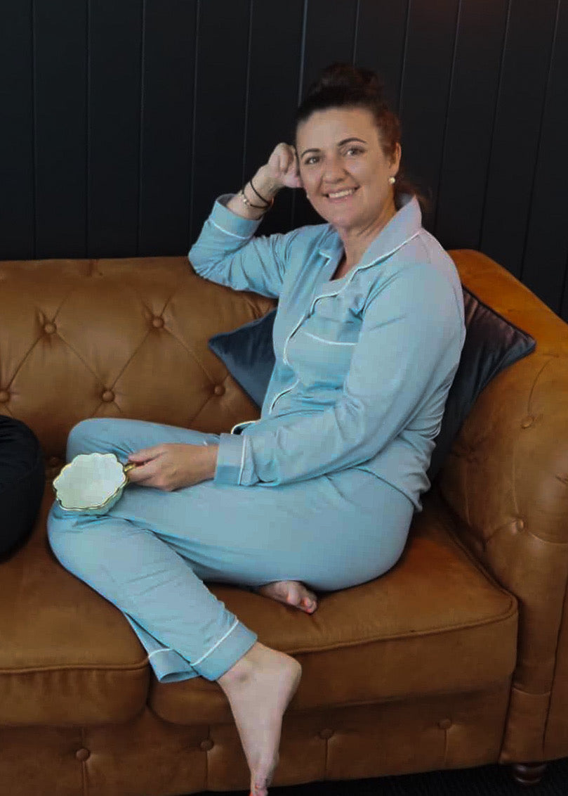Woman wearing Maisie Storm Blue Long Sleeve Bamboo PJ Set – women’s breathable bamboo sleepwear in Australia